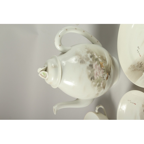 1006 - A JAPANESE VINTAGE PORCELAIN TEA SET, each piece painted with landscape scenes and inscriptions, (qt... 