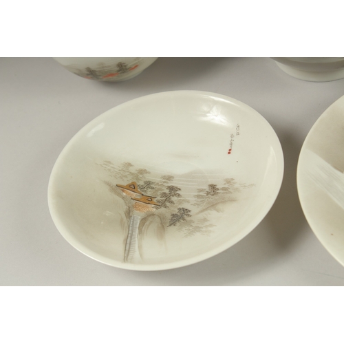 1006 - A JAPANESE VINTAGE PORCELAIN TEA SET, each piece painted with landscape scenes and inscriptions, (qt... 