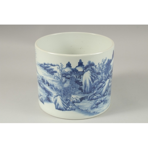 1013 - A LARGE CHINESE BLUE AND WHITE PORCELAIN CYLINDRICAL BRUSH POT, painted with a continuous landscape ... 