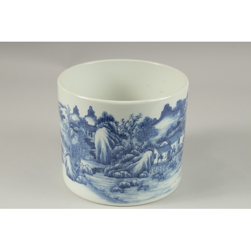 1013 - A LARGE CHINESE BLUE AND WHITE PORCELAIN CYLINDRICAL BRUSH POT, painted with a continuous landscape ... 