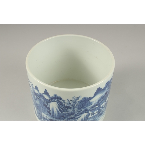 1013 - A LARGE CHINESE BLUE AND WHITE PORCELAIN CYLINDRICAL BRUSH POT, painted with a continuous landscape ... 