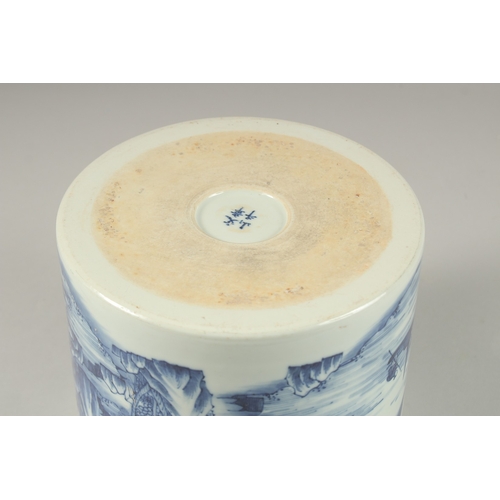 1013 - A LARGE CHINESE BLUE AND WHITE PORCELAIN CYLINDRICAL BRUSH POT, painted with a continuous landscape ... 