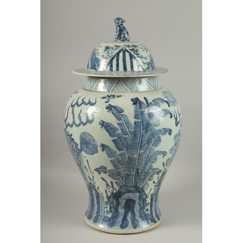 1017 - A LARGE CHINESE BLUE AND WHITE PORCELAIN BALUSTER FORM URN AND COVER, painted with mythical beasts a... 