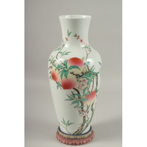 1018 - A LARGE CHINESE FAMILLE ROSE PORCELAIN PEACH VASE, with stand, vase 39.5cm high.