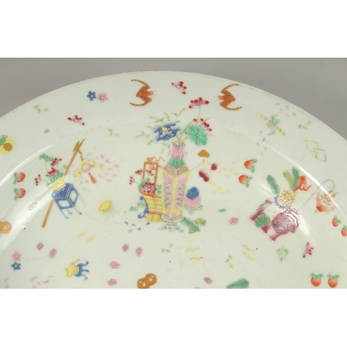 1021 - A CHINESE POLYCHROME PORCELAIN PLATE, painted with colourful enamels depicting precious objects, pea... 