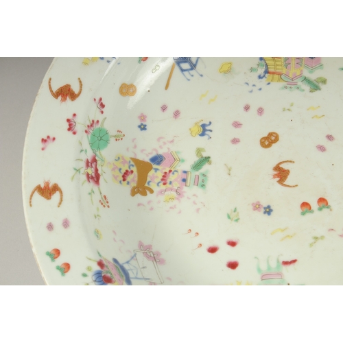 1021 - A CHINESE POLYCHROME PORCELAIN PLATE, painted with colourful enamels depicting precious objects, pea... 