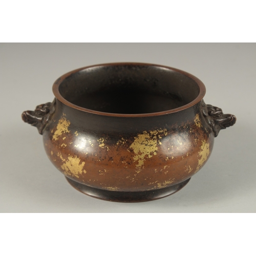 1022 - A CHINESE GOLD SPLASH BRONZE TWIN HANDLE CENSER, the base with character mark, 19cm wide handle to h... 