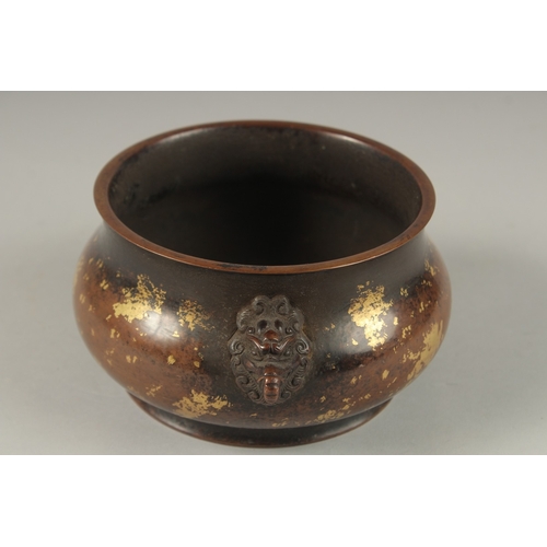 1022 - A CHINESE GOLD SPLASH BRONZE TWIN HANDLE CENSER, the base with character mark, 19cm wide handle to h... 