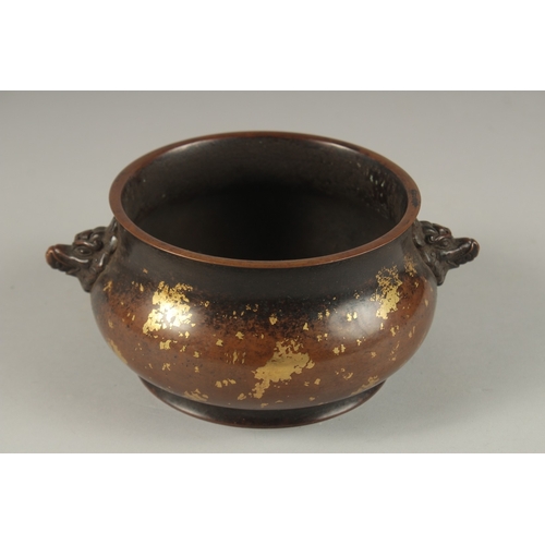 1022 - A CHINESE GOLD SPLASH BRONZE TWIN HANDLE CENSER, the base with character mark, 19cm wide handle to h... 