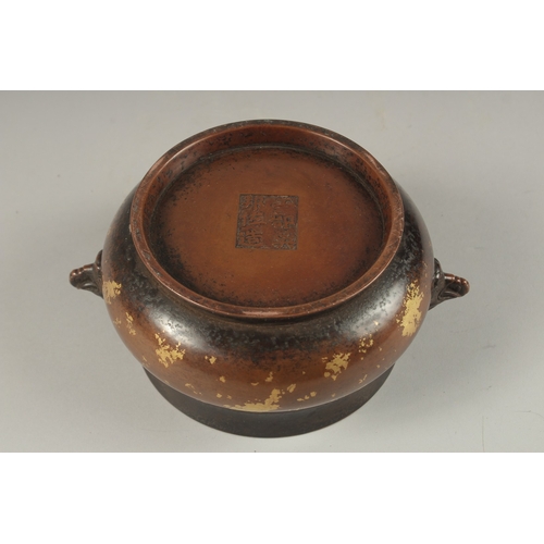 1022 - A CHINESE GOLD SPLASH BRONZE TWIN HANDLE CENSER, the base with character mark, 19cm wide handle to h... 