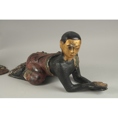 1023 - A PAIR OF LARGE CARVED AND LACQUERED WOOD CRAWLING BUDDHAS, each with gilded faces and coloured glas... 