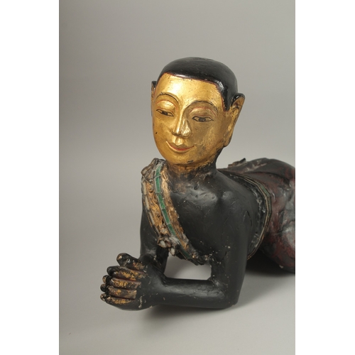 1023 - A PAIR OF LARGE CARVED AND LACQUERED WOOD CRAWLING BUDDHAS, each with gilded faces and coloured glas... 