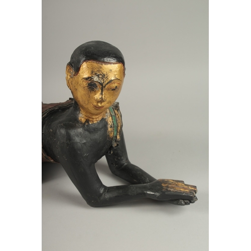 1023 - A PAIR OF LARGE CARVED AND LACQUERED WOOD CRAWLING BUDDHAS, each with gilded faces and coloured glas... 