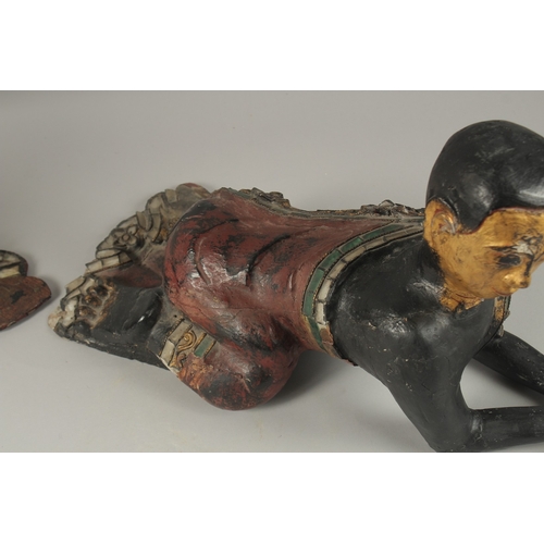 1023 - A PAIR OF LARGE CARVED AND LACQUERED WOOD CRAWLING BUDDHAS, each with gilded faces and coloured glas... 