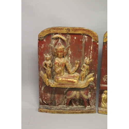 1024 - THREE LARGE RELIEF CARVED WOODEN BUDDHISTIC PANELS, each panel gilded and lacquered in red with carv... 