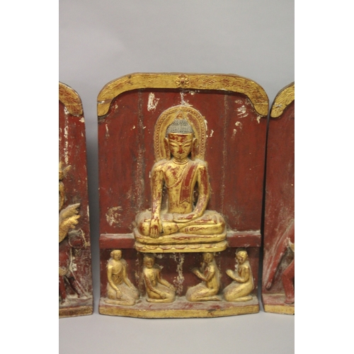 1024 - THREE LARGE RELIEF CARVED WOODEN BUDDHISTIC PANELS, each panel gilded and lacquered in red with carv... 