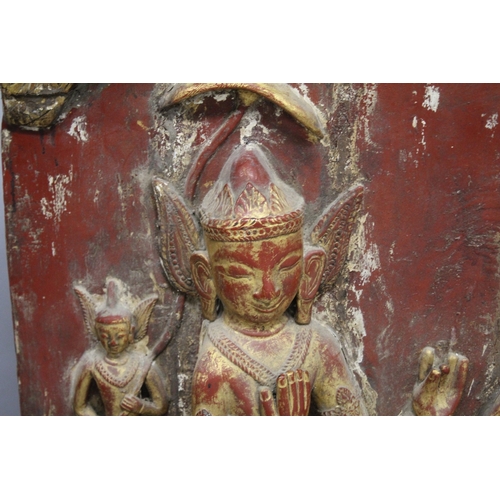 1024 - THREE LARGE RELIEF CARVED WOODEN BUDDHISTIC PANELS, each panel gilded and lacquered in red with carv... 