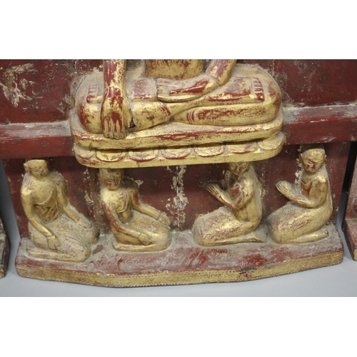 1024 - THREE LARGE RELIEF CARVED WOODEN BUDDHISTIC PANELS, each panel gilded and lacquered in red with carv... 