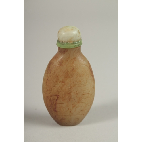 1029 - A CHINESE CARVED JADE SCENE BOTTLE, with calligraphy, 6.5cm high.