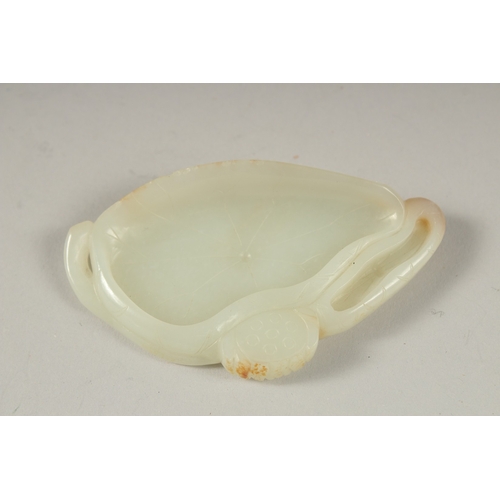 1033 - A GOOD CHINESE CARVED JADE LILY PAD, 7.5cm long, 4cm wide.