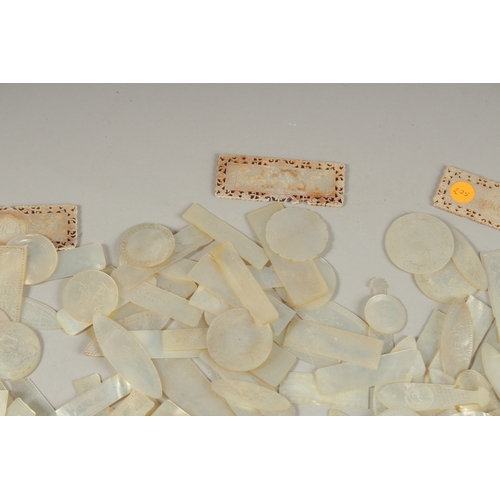 1036 - A LARGE QUANTITY OF CHINESE CARVED MOTHER OF PEARL COUNTERS, various forms and sizes, (qty).