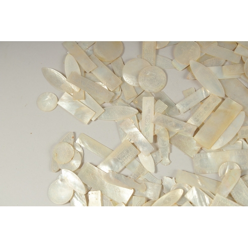 1036 - A LARGE QUANTITY OF CHINESE CARVED MOTHER OF PEARL COUNTERS, various forms and sizes, (qty).