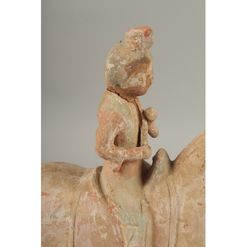 1040 - A TANG POTTERY HORSE AND RIDER, 32cm high.