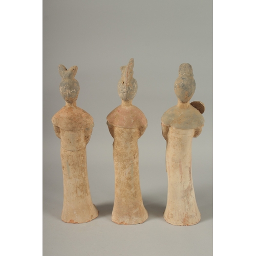 1041 - THREE TANG POTTERY TOMB FIGURES, tallest 41cm high.