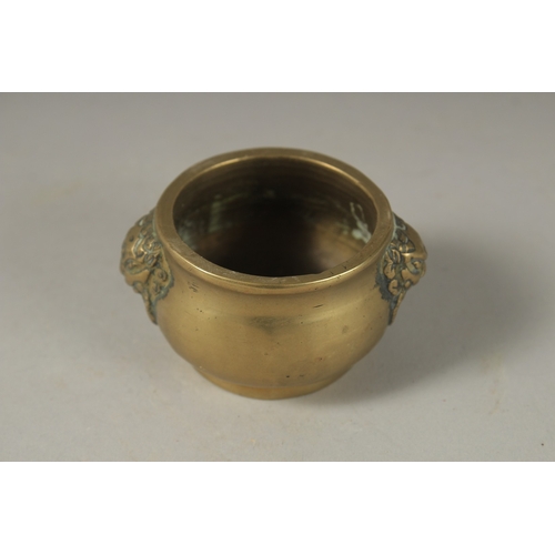 1048 - A MINIATURE 18TH CENTURY BRONZE CENSER, with lion ring handles, 5cm diameter.