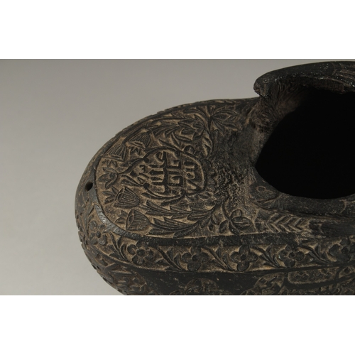 1049 - A SUPERB EXTENSIVELY CARVED COCO DE MER, with Islamic calligraphy, 30cm long, 14cm wide, 11cm deep.