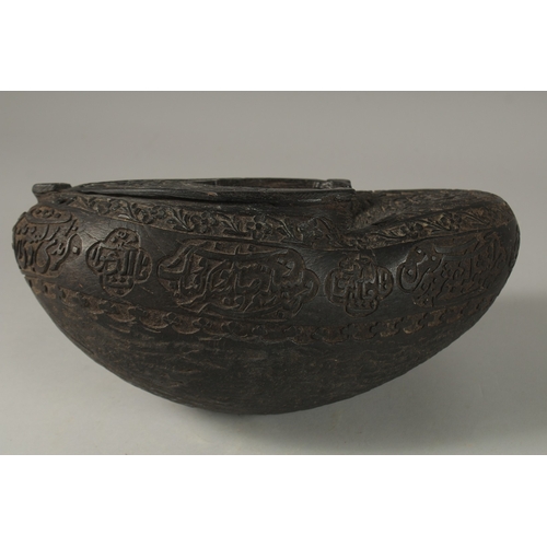 1049 - A SUPERB EXTENSIVELY CARVED COCO DE MER, with Islamic calligraphy, 30cm long, 14cm wide, 11cm deep.