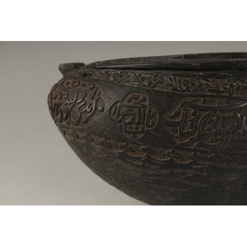 1049 - A SUPERB EXTENSIVELY CARVED COCO DE MER, with Islamic calligraphy, 30cm long, 14cm wide, 11cm deep.