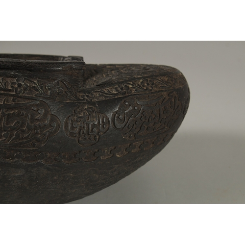 1049 - A SUPERB EXTENSIVELY CARVED COCO DE MER, with Islamic calligraphy, 30cm long, 14cm wide, 11cm deep.