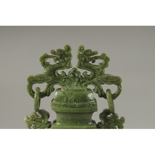 1058 - A LARGE CHINESE CARVED JADE LIDDED VASE, with twin drop ring handles and carved with dog of o, mount... 