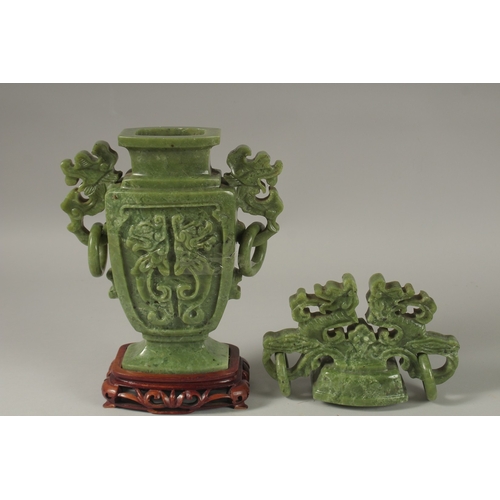 1058 - A LARGE CHINESE CARVED JADE LIDDED VASE, with twin drop ring handles and carved with dog of o, mount... 