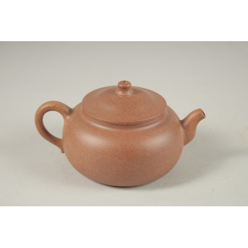 1294 - A CHINESE YIXING TEAPOT, with incised calligraphy, impressed marks to inner lid and base.