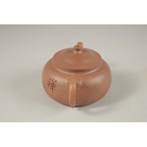 1294 - A CHINESE YIXING TEAPOT, with incised calligraphy, impressed marks to inner lid and base.