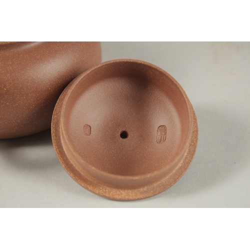 1294 - A CHINESE YIXING TEAPOT, with incised calligraphy, impressed marks to inner lid and base.