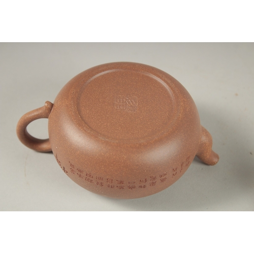 1294 - A CHINESE YIXING TEAPOT, with incised calligraphy, impressed marks to inner lid and base.