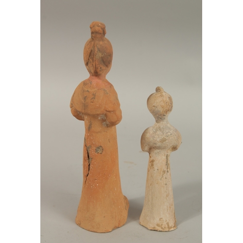 1042 - TWO CHINESE POTTERY FIGURES, 26.5cm and 18cm high.