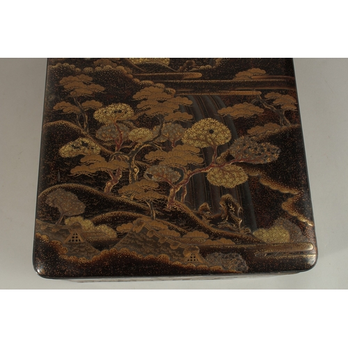 1061 - A VERY FINE JAPANESE MEIJI PERIOD GILT AND BLACK LACQUER BOX, beautifully decorated with landscape s... 