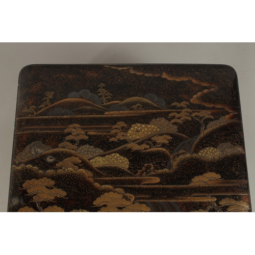 1061 - A VERY FINE JAPANESE MEIJI PERIOD GILT AND BLACK LACQUER BOX, beautifully decorated with landscape s... 