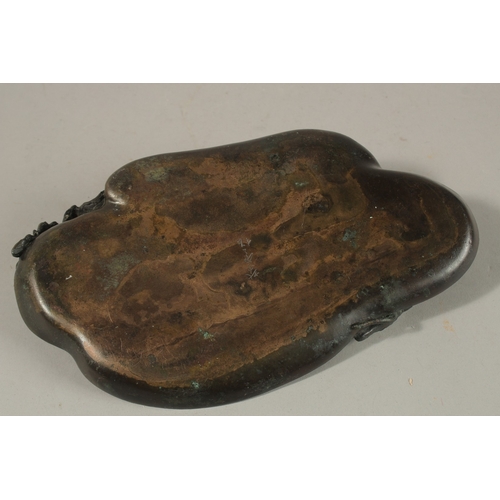 1066 - A SIGNED JAPANESE BRONZE TRAY, the corner with an okimono of a bird on a leaf, signed to base, 23cm ... 