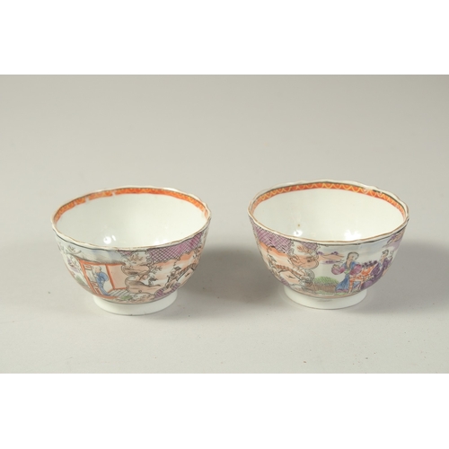 1074 - A PAIR OF CHINESE EXPORT PORCELAIN CUPS, each painted with scenes of figures, 8.5cm diameter.