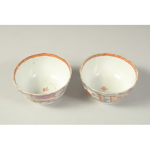 1074 - A PAIR OF CHINESE EXPORT PORCELAIN CUPS, each painted with scenes of figures, 8.5cm diameter.