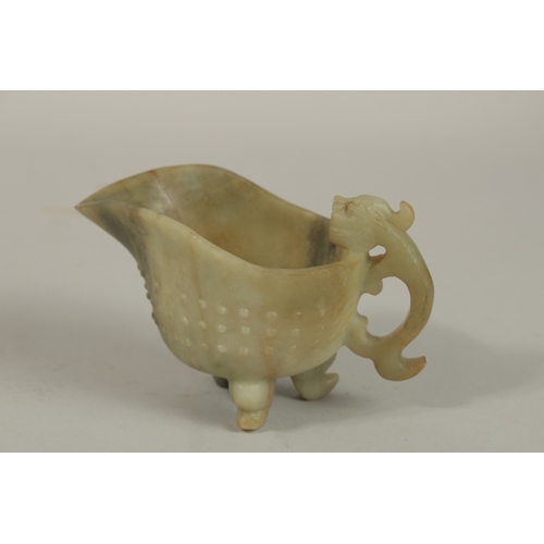 1213 - A CHINESE CARVED JADE OR GREEN HARDSTONE RITUAL JUG, with carved chilong handle and tripod legs, 13c... 