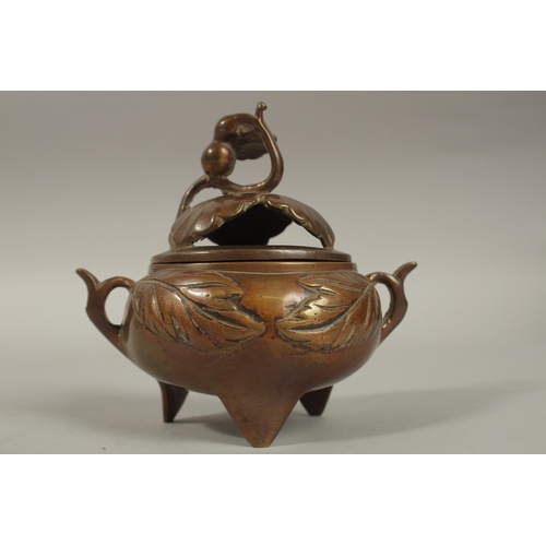 1214 - A CHINESE BRASS TWIN HANDLE CENSER AND COVER, 11cm high.