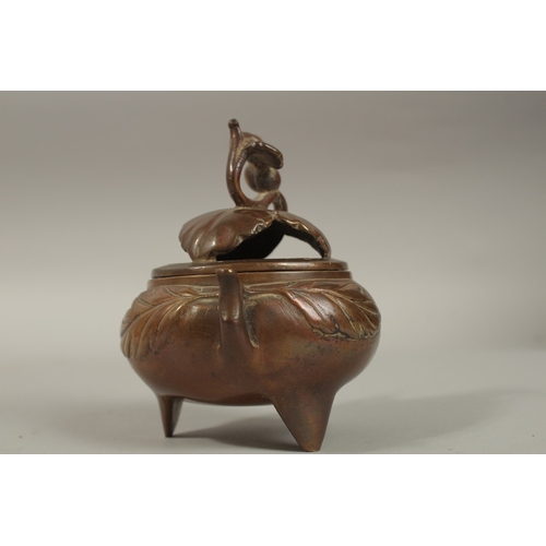 1214 - A CHINESE BRASS TWIN HANDLE CENSER AND COVER, 11cm high.