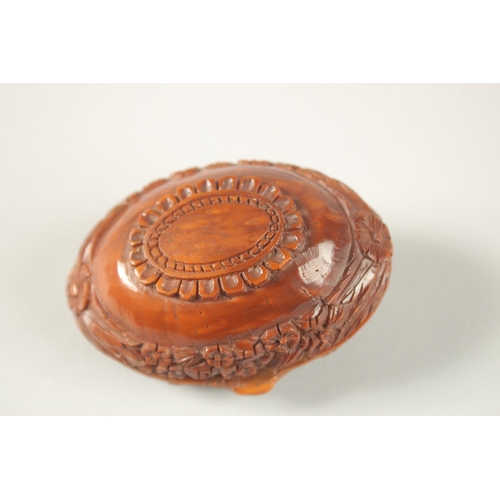 1269 - A CHINESE EXPORT CARVED NUT BOX, with European decoration.