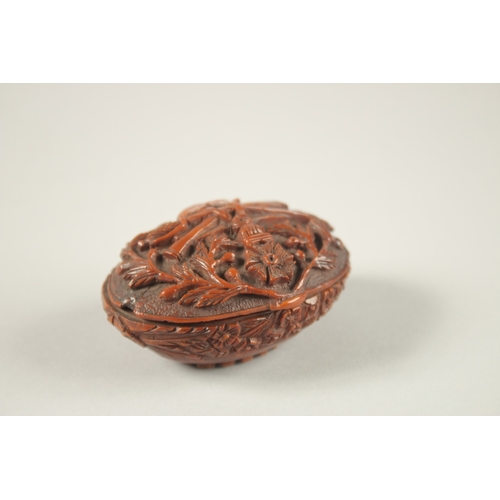 1269 - A CHINESE EXPORT CARVED NUT BOX, with European decoration.